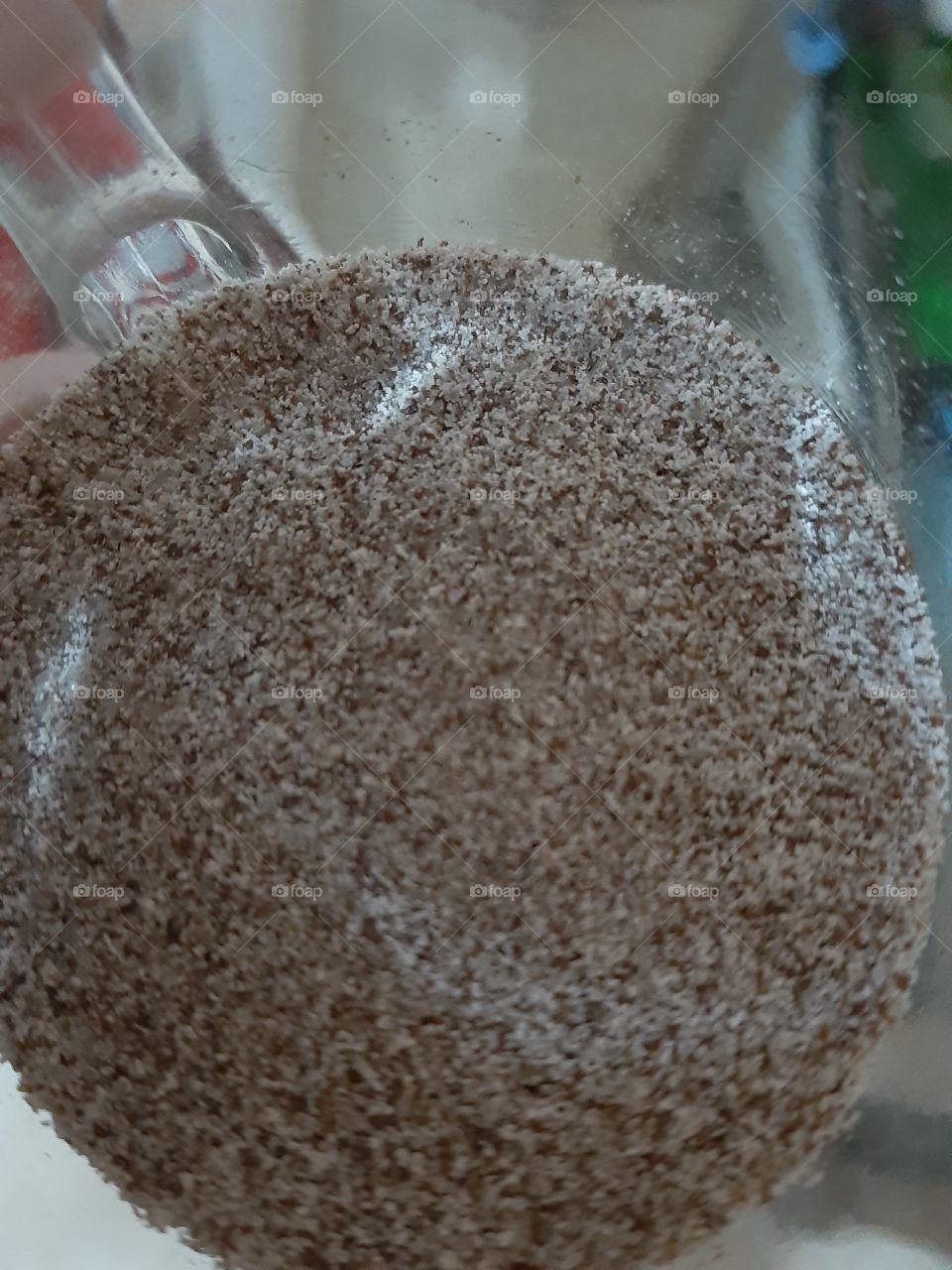 A tiny coffe powder in a mini glass