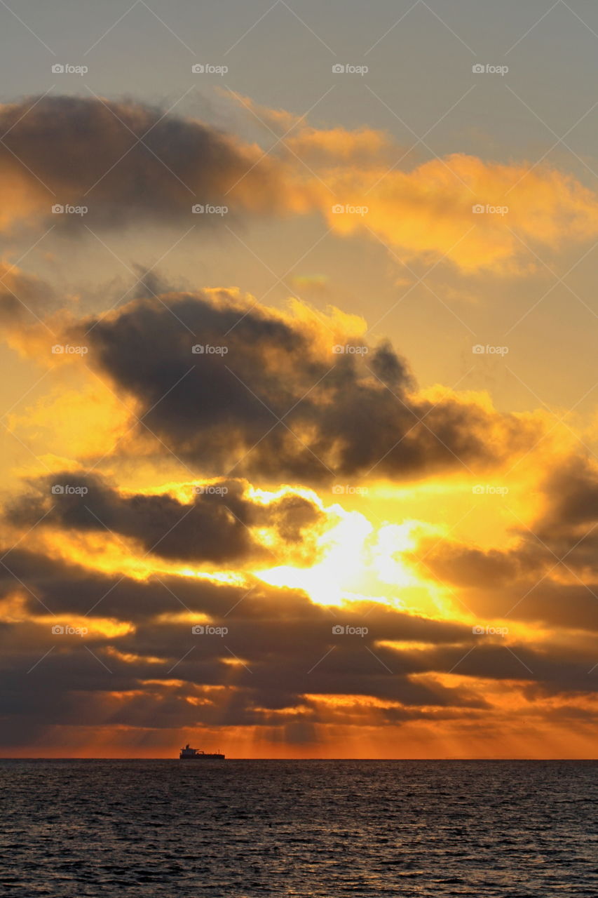 Scenic view of dramatic sky over sea