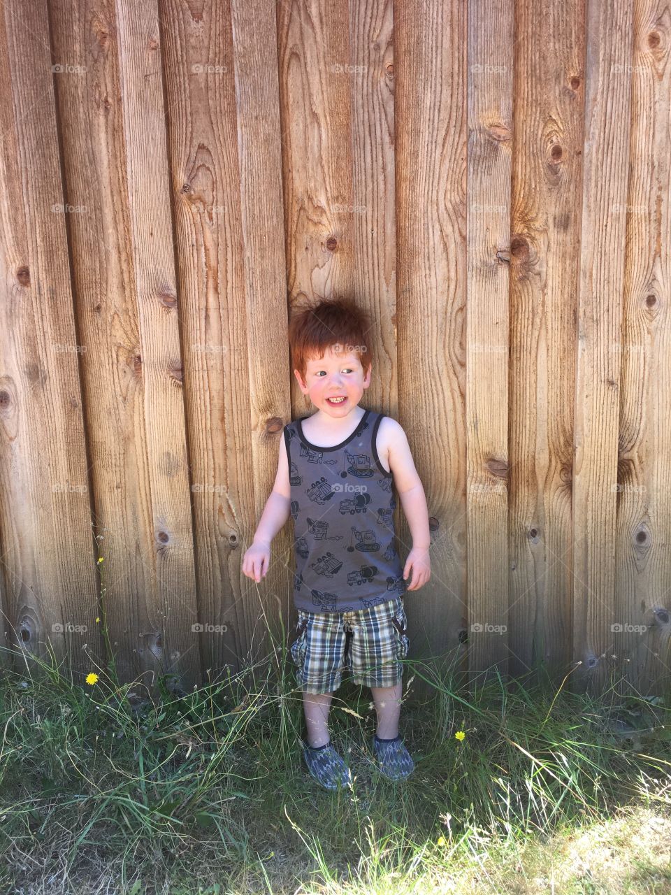 Red head toddler having fun in the sun