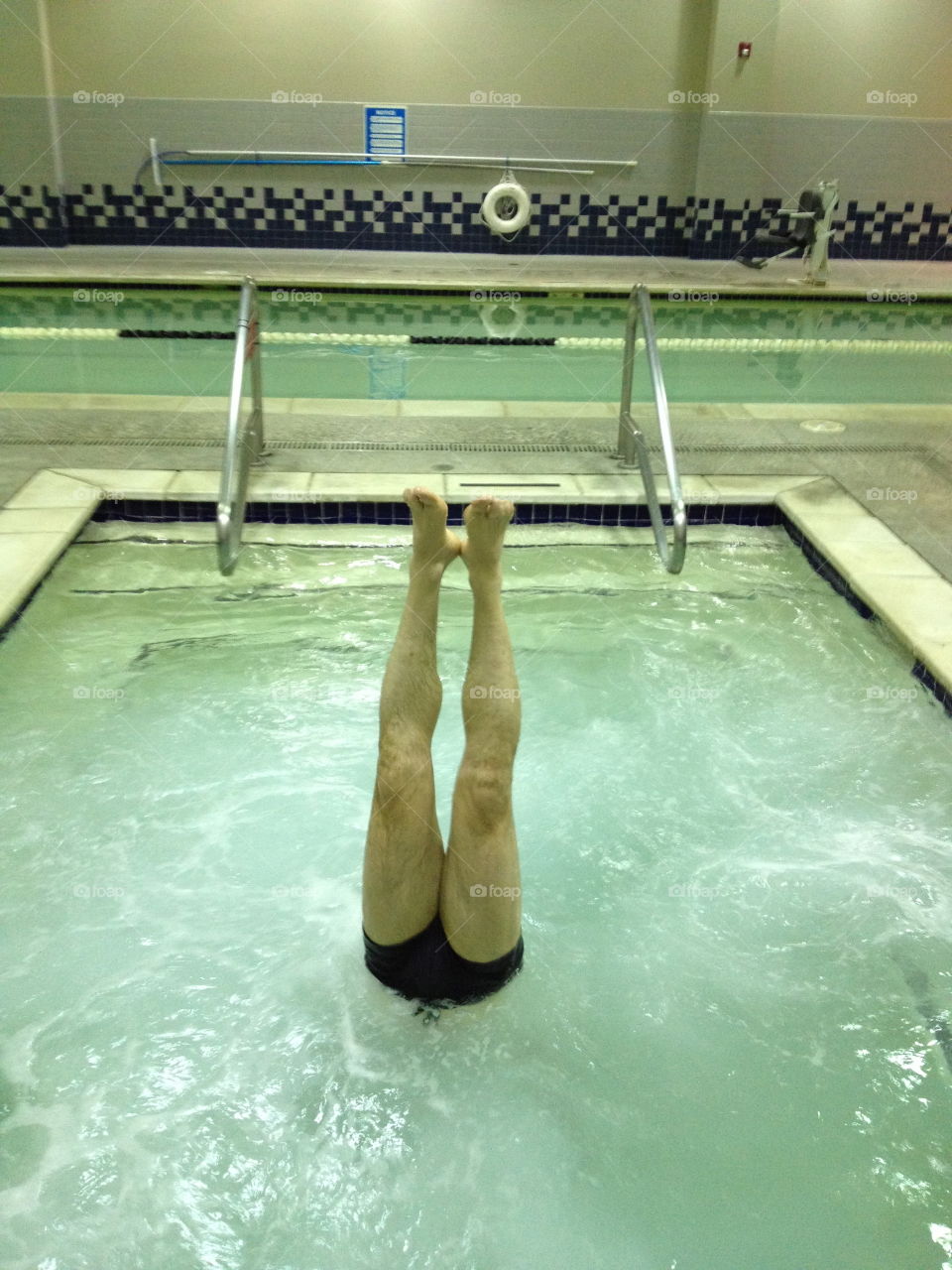 Head-standing Swimmer in Hot Tube 
