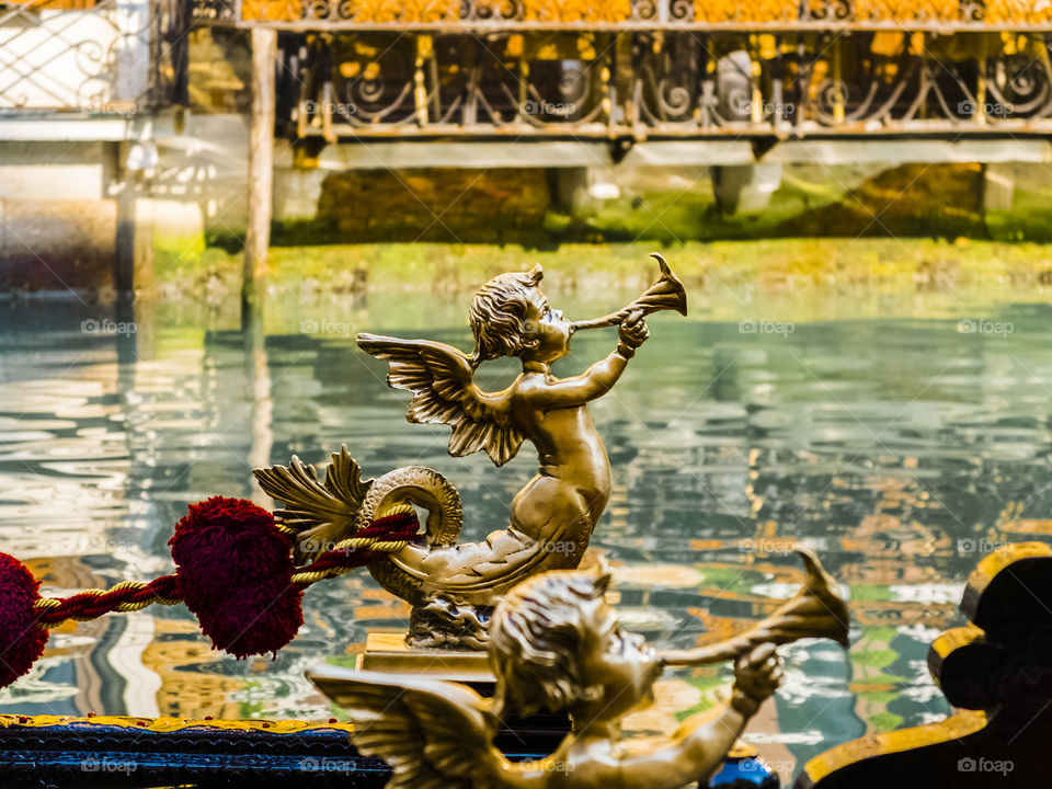 A photo, a detail ... and I see Venice on Easter. The statuette of a gondola expresses all the Venetian and Italian magic and culture. The shallow depth of field emphasizes the detail and quality of light.