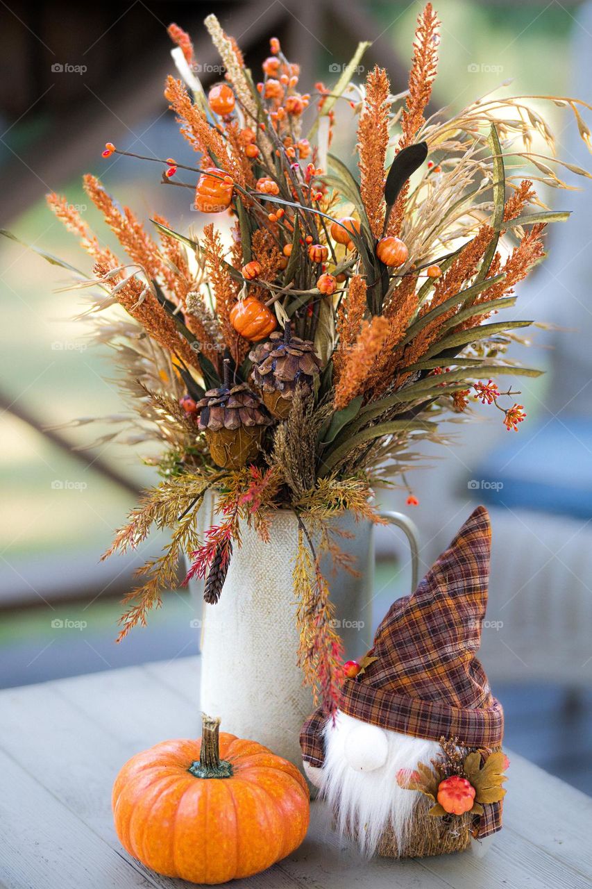 Autumn Floral Arrangement with Pumpkins and Gnome