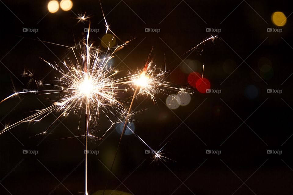 Burning sparkler at night