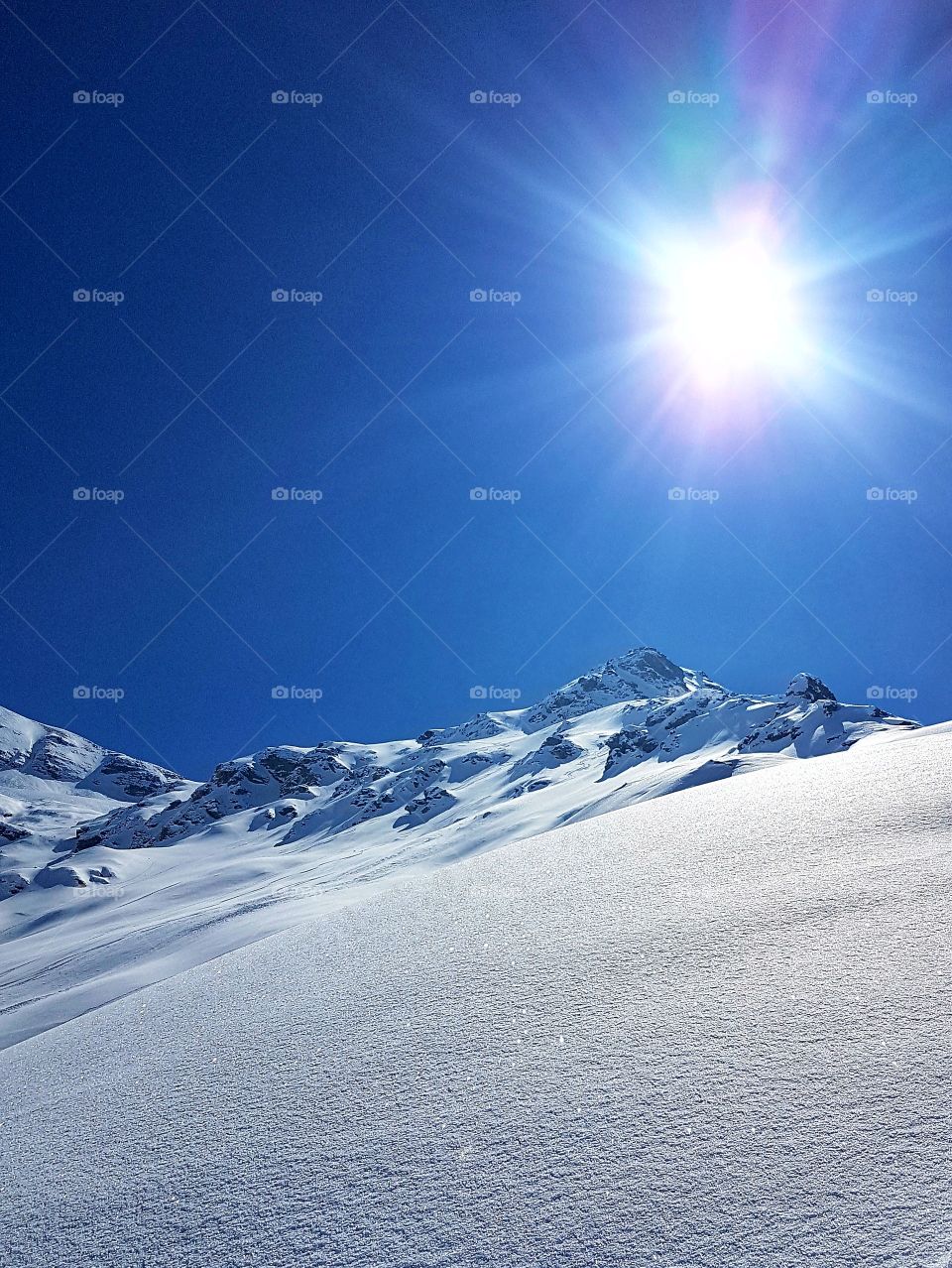 Snow mountain in the sun