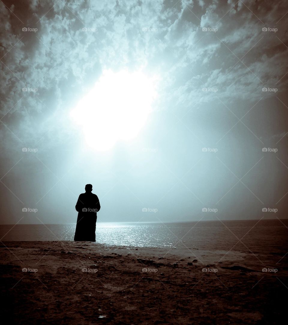 A person needs to stand in front of the sea to rest
Cute man on a beach on the island of Djerba