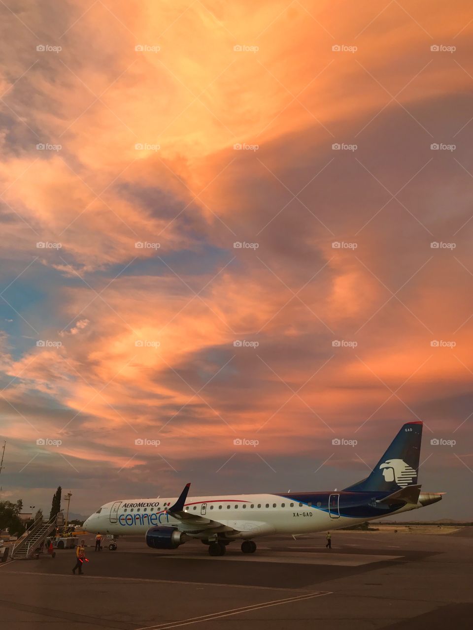 Jet plane under beautiful sunset sky