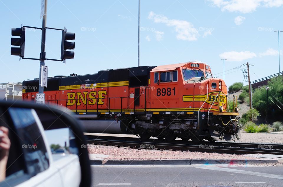 Photograph of a passing train while driving through Phoenix.