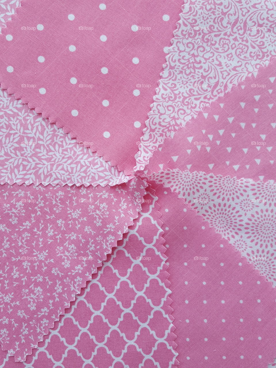 assorted pink fabrics