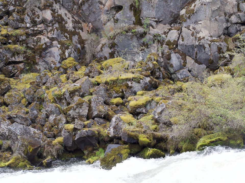 Rough and jagged rock walls form the canyon at Dillon Falls on the Deschutes River in Central Oregon. 