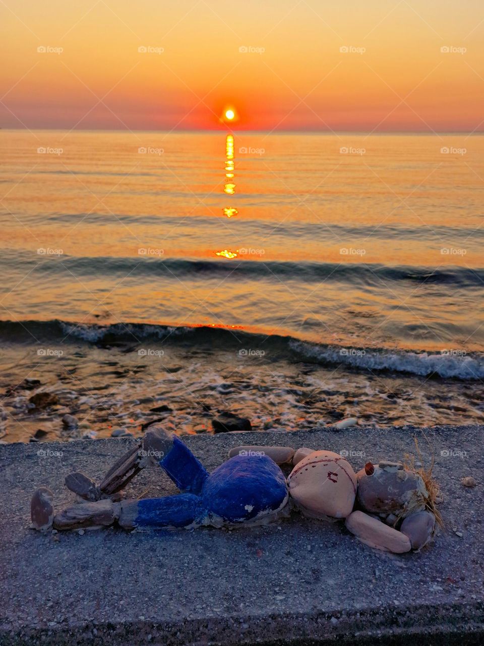 the stone doll at the beach