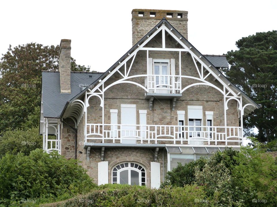 Large 19th century seaside villa overlooking the bay of Terenec in Brittany. Many decorated balconies.