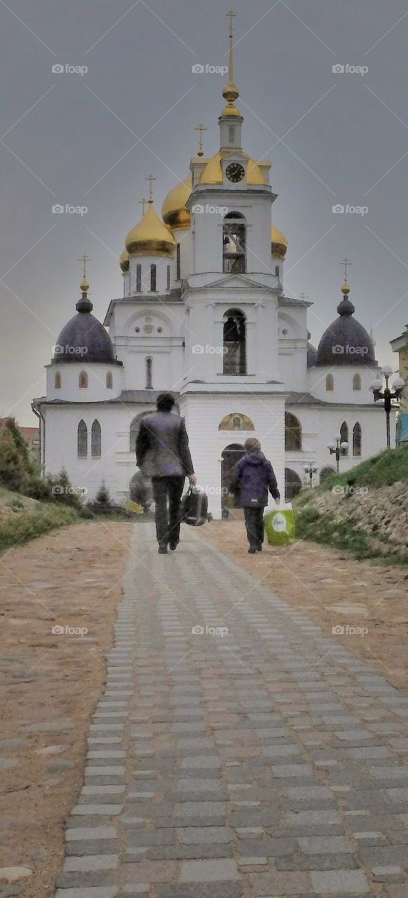 Walk the faith.
This shot I made in old Russian city called Dmitrov. I think that man and a boy are father and son. Who knows may be they walk to that church to talk to God.