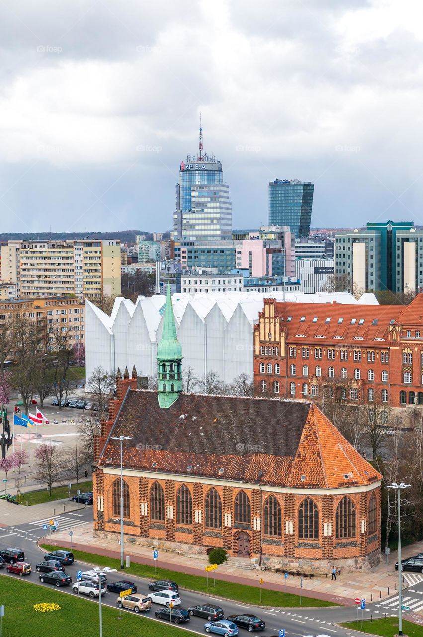 High angle postcard view at Szczecin town with rooftops and modern, white, abstract Philharmonic Concert Hall (Icebergs). Poland