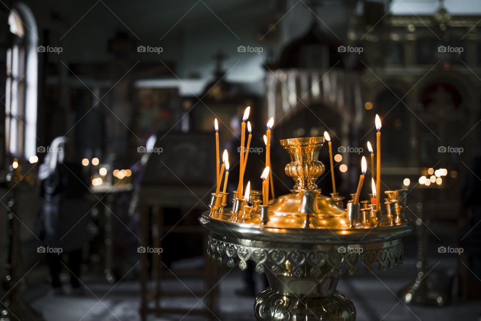Orthodox church interior with candles.  Dark mood style