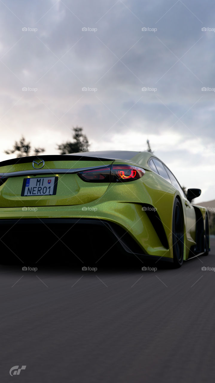 Yellow wide body kit Race modified Mazda 6 ( Atenza ) skyactive going fast on countryside road in the morning 