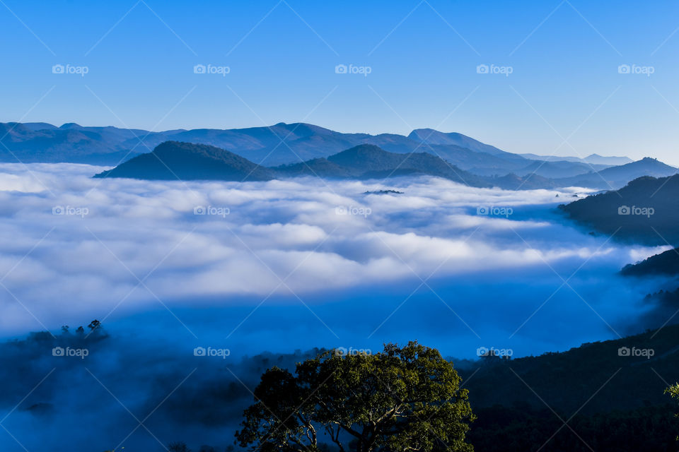 Rare and awesome moment of visiting snow spread on mountains like  milky waves.