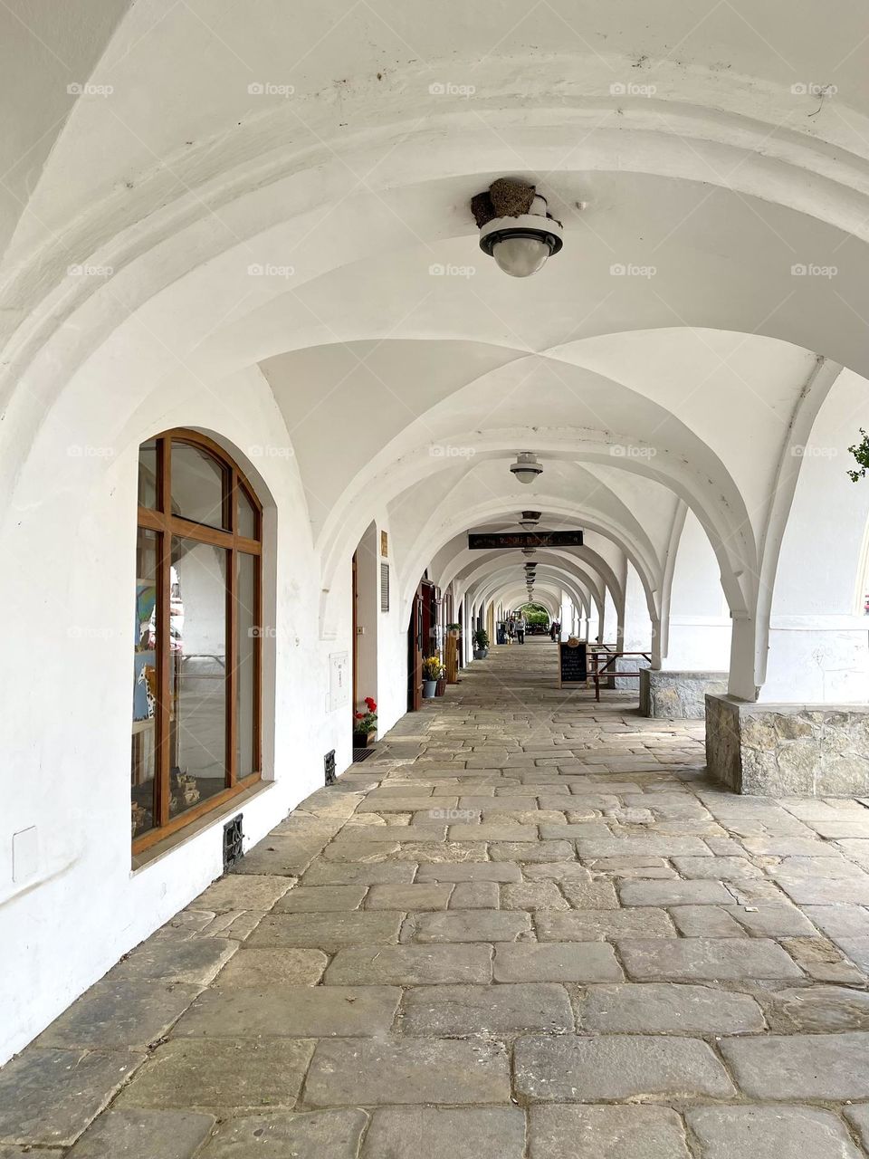 Alley with white arches, perspective view 