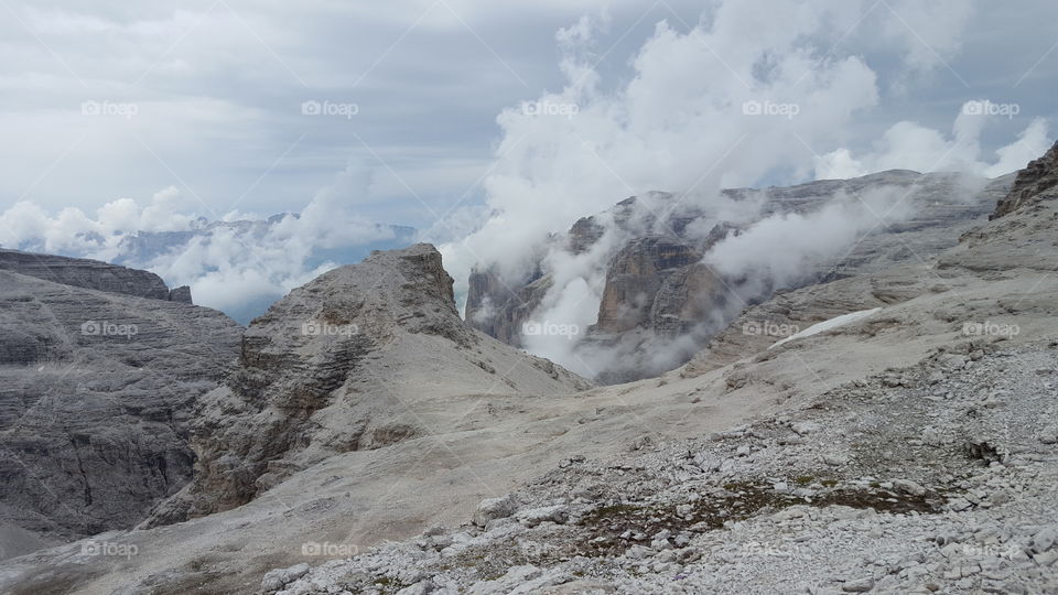 View of rocky mountains during foggy weather