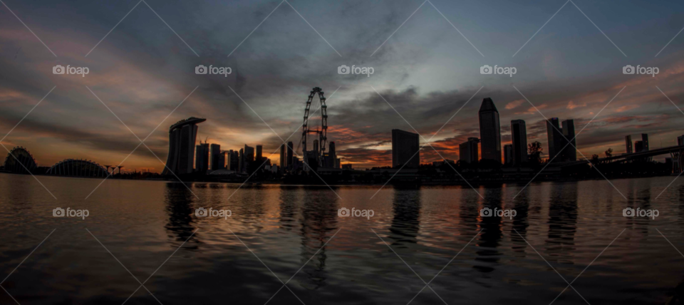 singapore sunset skyline silhouette by paulcowell