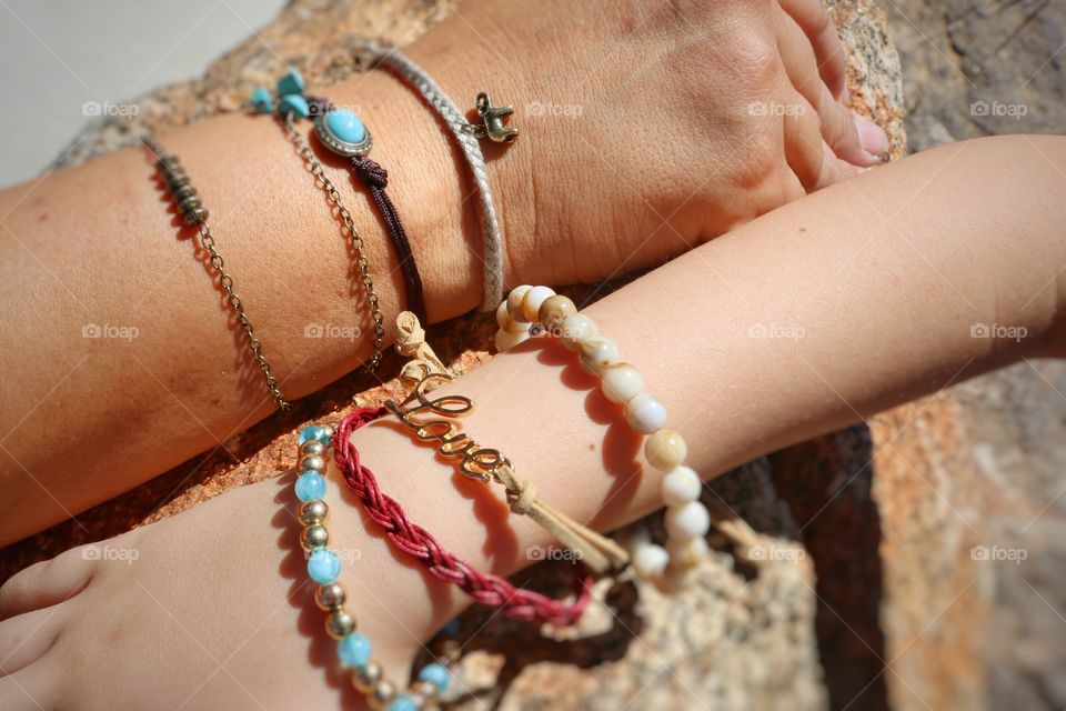 Mom and daughter wearing handmade bracelets