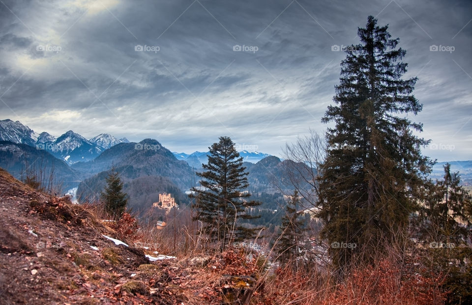 Bavarian Alpine with castle at snowless winter