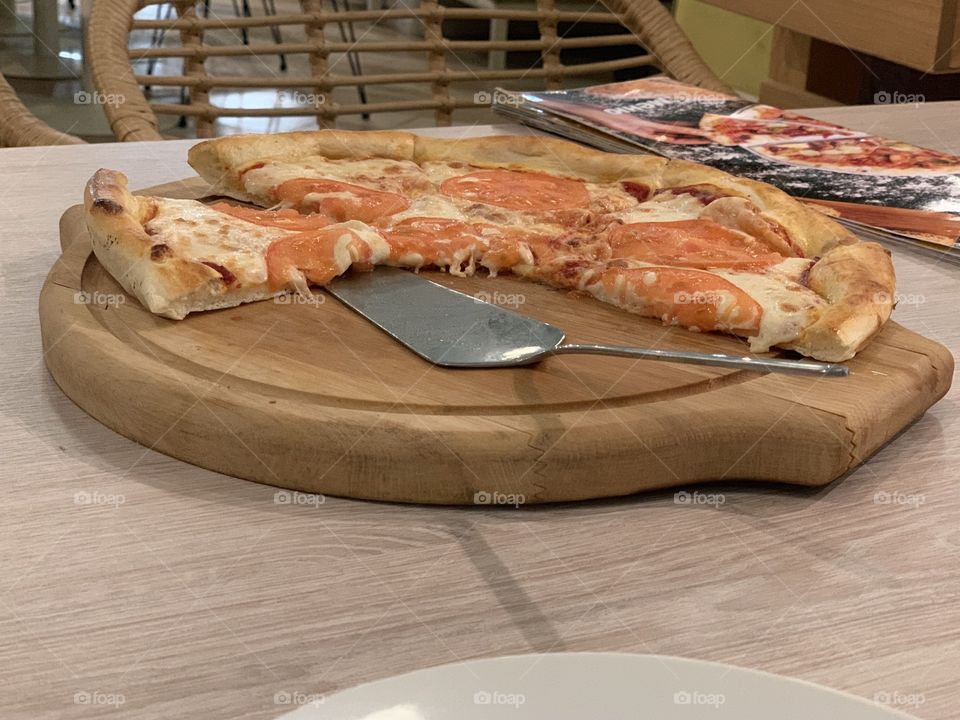 pizza with cheese and tomatoes