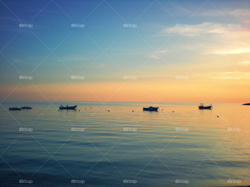 The soft tone colours of the  sea water  at sunset  (Praia - Italy ).