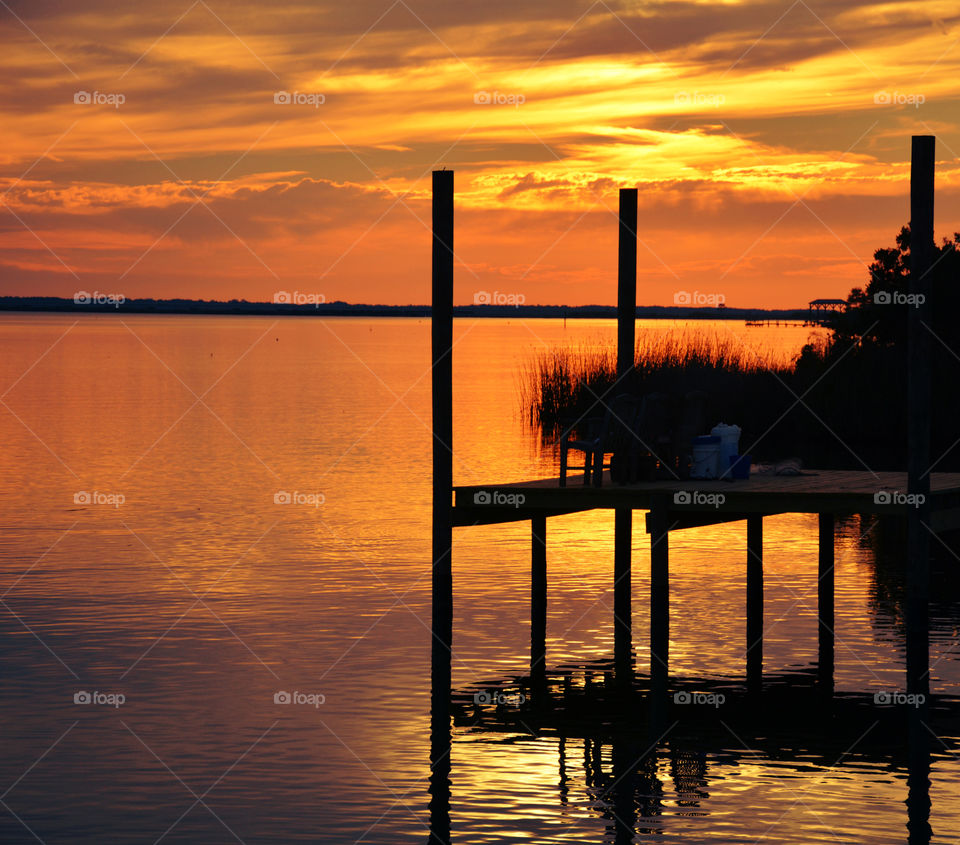 Silhouette of pier during sunset