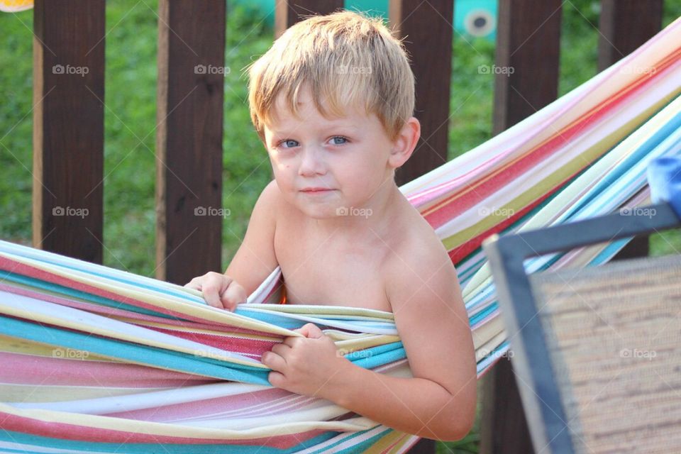 Portrait of a boy in hammock