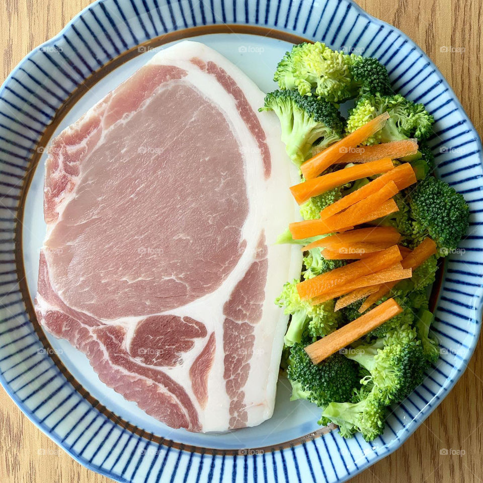Pork loin steak with broccoli and carrots for lunch or dinner 