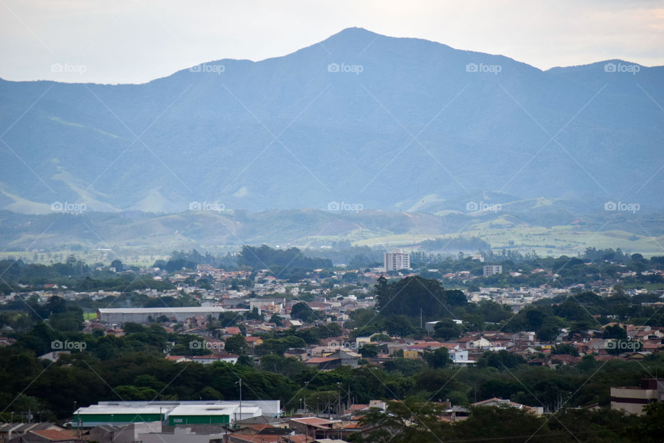 The view of the city and a rural area in the background in Taubaté SP Brazil.