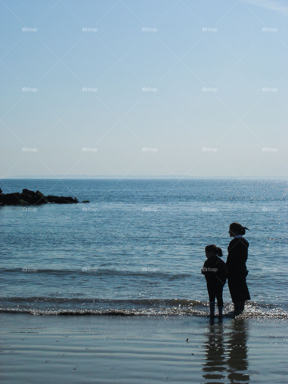 Mother and daughter. At Coney Island beach
