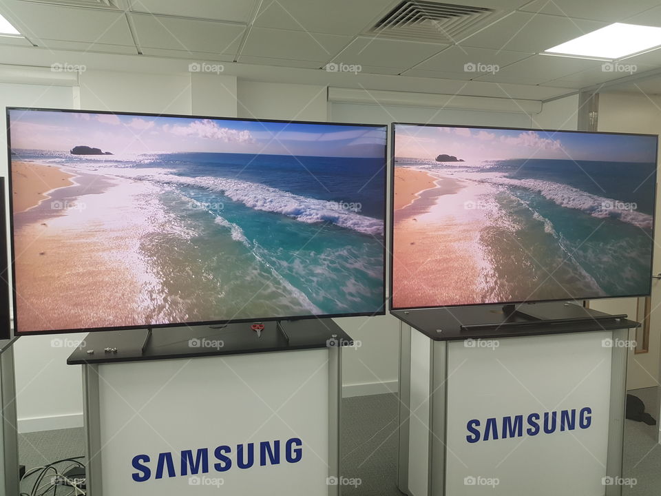 Samsung QLED 8K and 4K televisions displaying nature scenes comparison