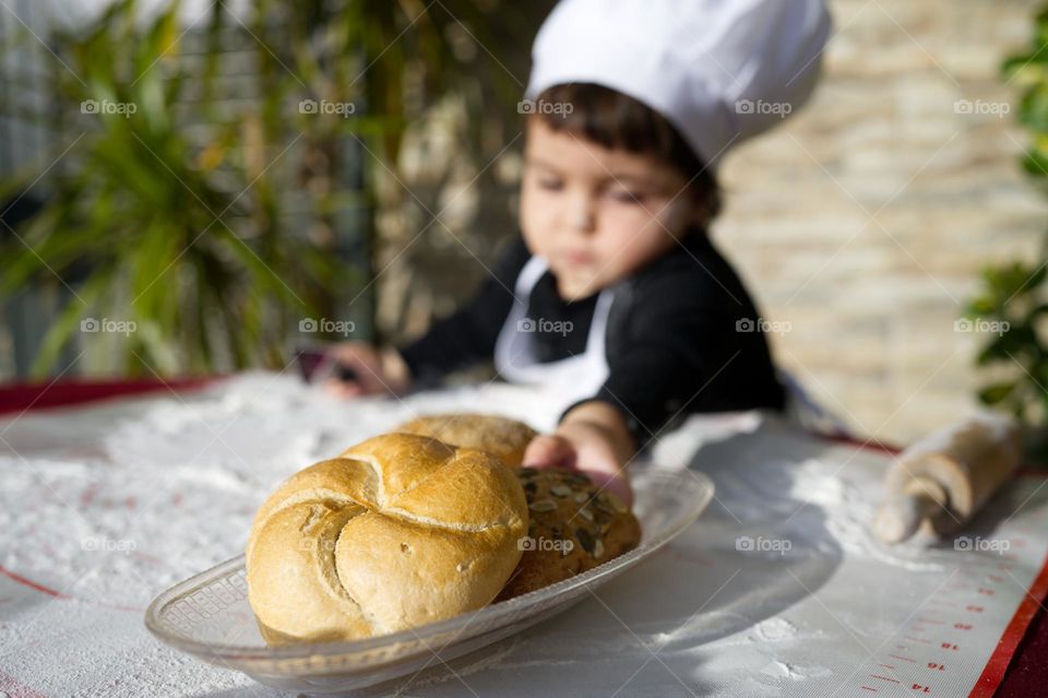 little girl chef preparing bread