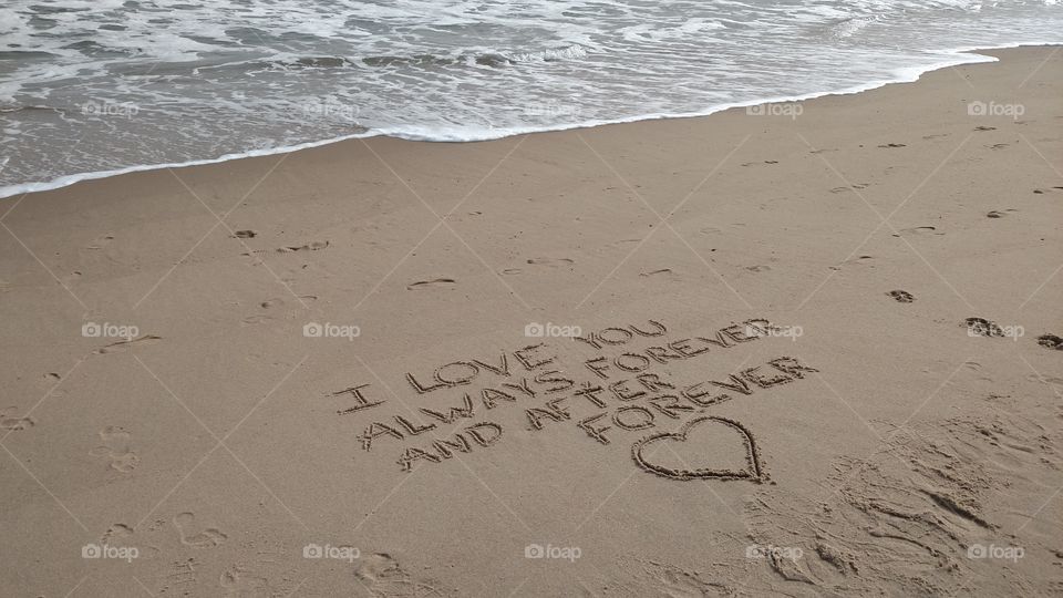 Love declaration in the sand