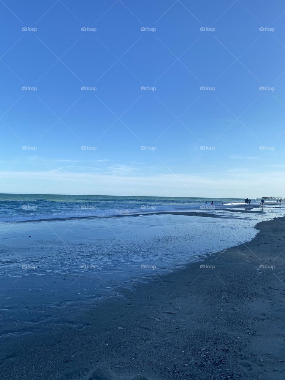 As the waves push the sand 