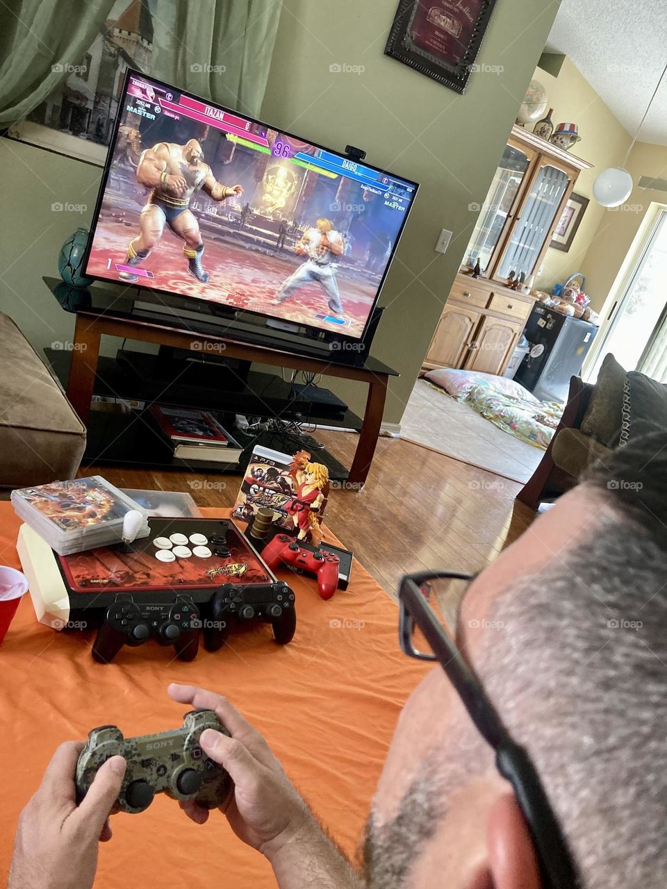 Man playing street fighter video game photography mission 