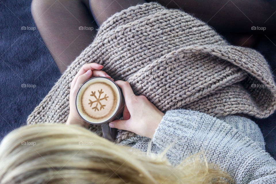 Girl in bed with coffee cup