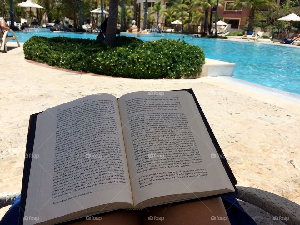 Relaxing with a Book Poolside 