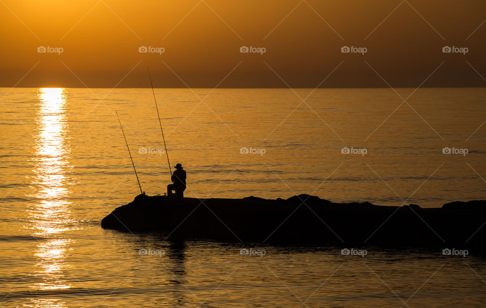 Fisherman at sunset; Mediterranean Sea