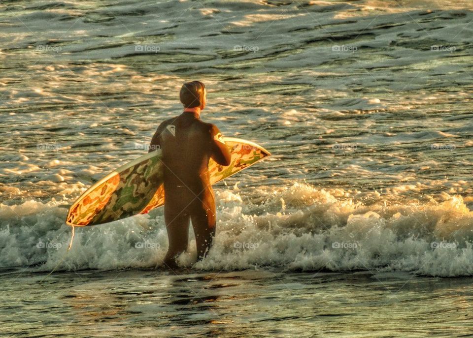 California Surfer. Surfer Entering The Ocean At Sunset
