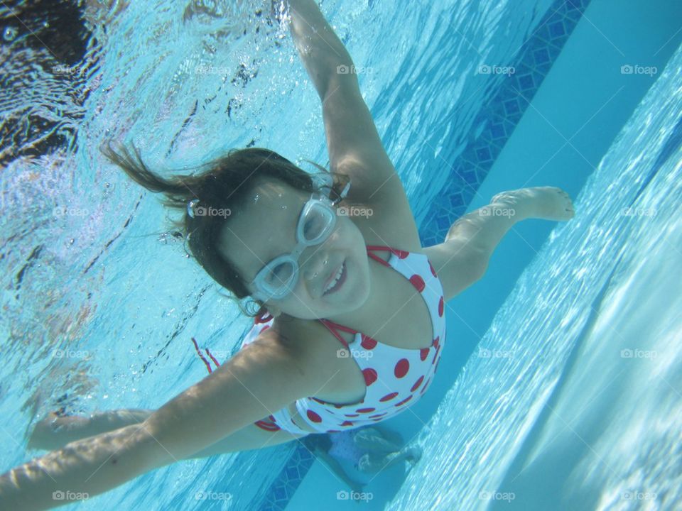 Underwater girl in swimming pool