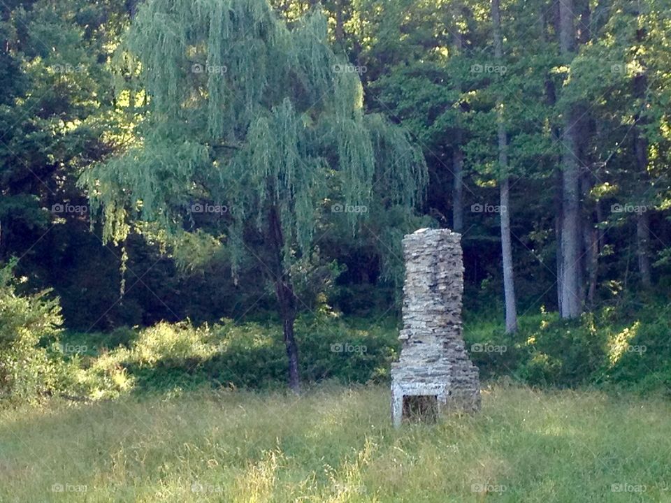 Chimney of stone is all that remains of a wooden cabin long gone