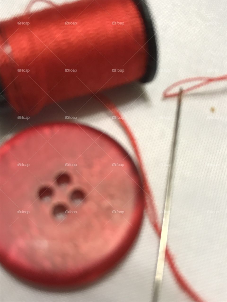 Red button and thread