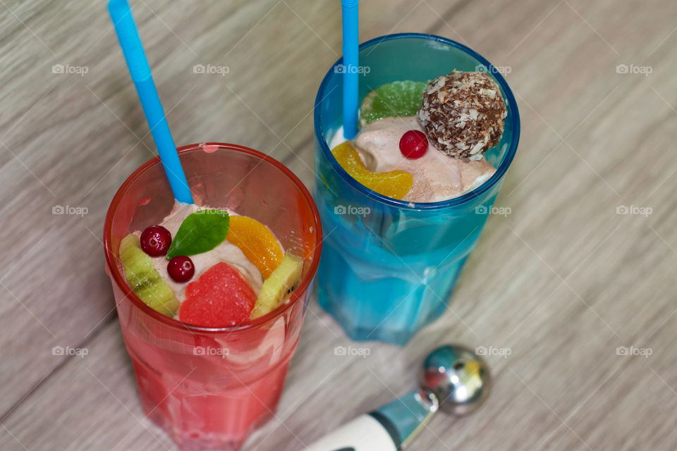 ice cream in glasses with fruit and marmalade