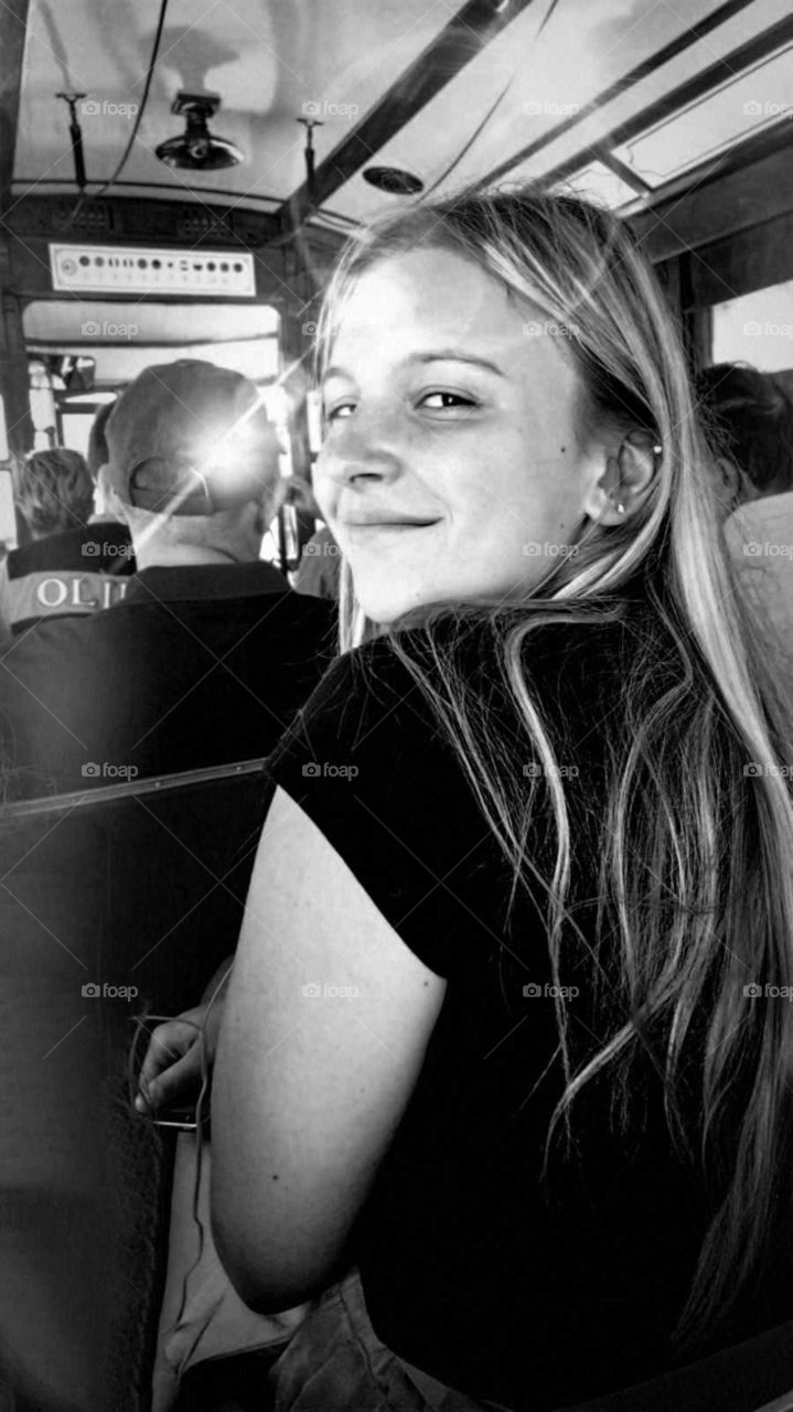 girl smiling in a tramway in Portugal