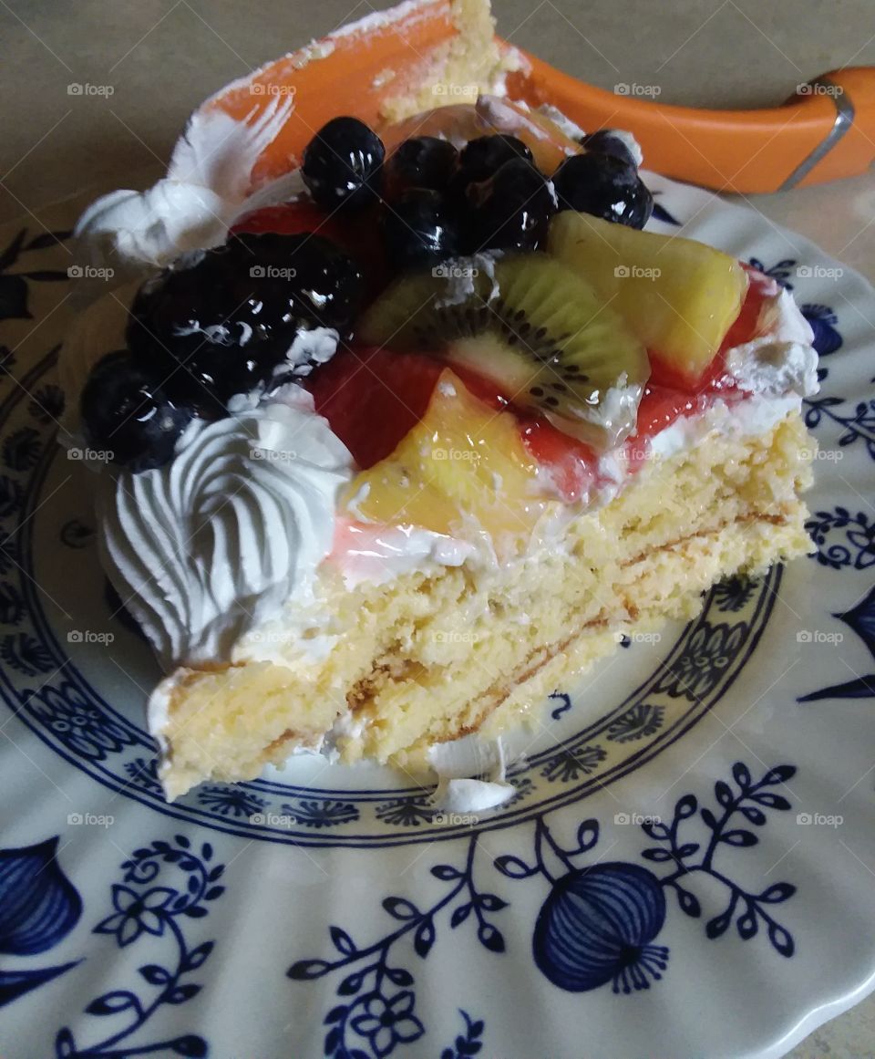 moist delicious dessert topped with fresh fruit