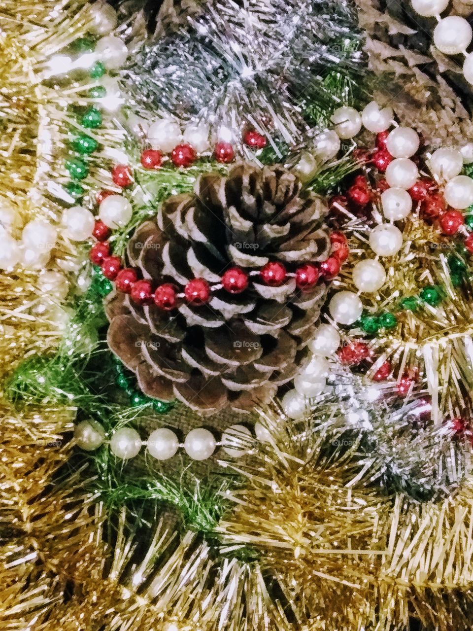 pinecone among tinsel