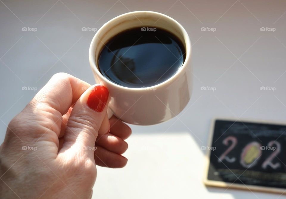 cup of coffee in the female hand relaxing New year resolution