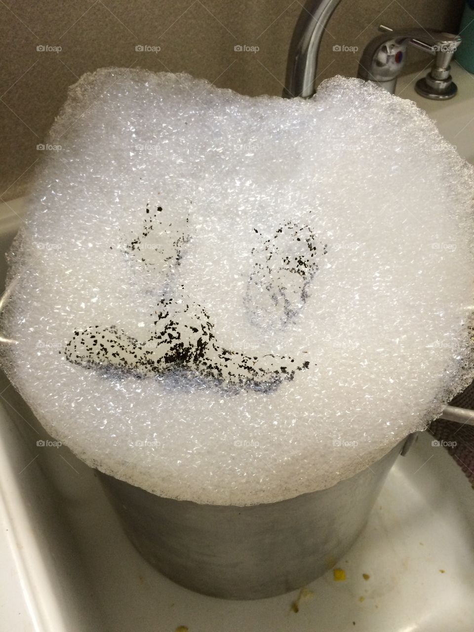 Kitty Suds. I made a face with coffee grounds in my bubbles